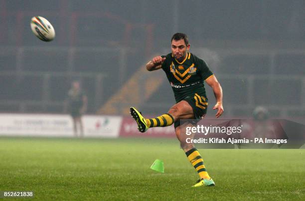 Australia's Cameron Smith kicks during the 2013 World Cup match at Thomond Park, Limerick, Ireland.