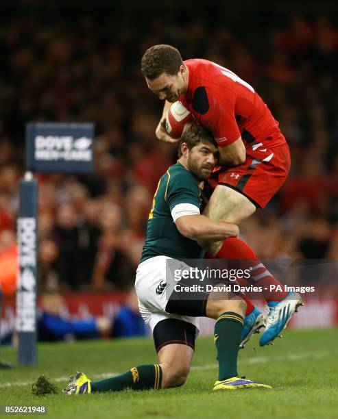 Wales George North is tackled by South Africa's Willie Le Roux during the Dove Men Series match at the Millennium Stadium, Cardiff.
