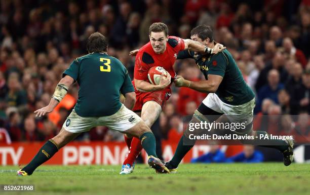 Wales George North takes on South Africa's Frans Malherbe during the Dove Men Series match at the Millennium Stadium, Cardiff.