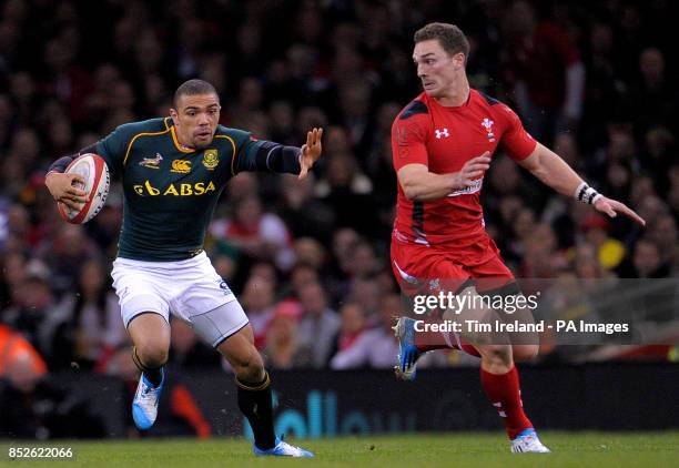 South Africa's Bryan Habana beats Wales' George North during the Dove Men Series match at the Millennium Stadium, Cardiff.