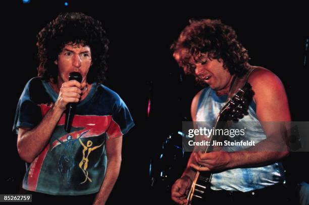 Kevin Cronin and Gary Richrath of REO Speedwagon Perform on their Wheels Are Turnin tour in Minneapolis, Minnesota in July 1987.