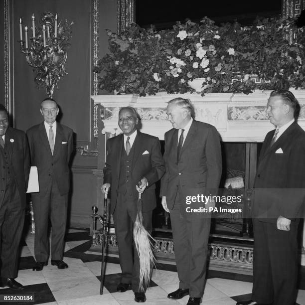 With his cane and fly-switch Dr. H. Kamuzu Banda, Prime Minister of Malawi, with British Prime Minister Harold Wilson before the opening of the...