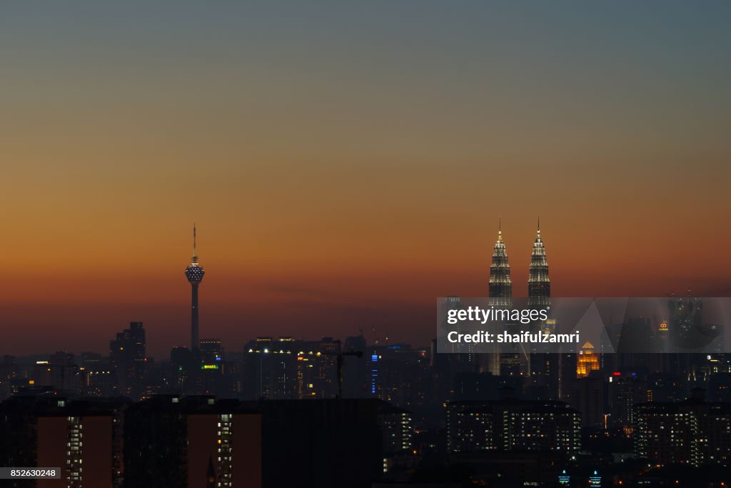 A cloudy sunset in Kuala Lumpur, the capital of Malaysia. Its modern skyline is dominated by the 451m tall KLCC, a pair of glass and steel clad skyscrapers.