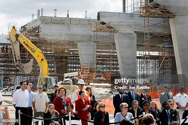 People listen as U.S. Vice President Joe Biden speaks during a visit to the Miami Intermodal Center on March 5, 2009 in Miami, Florida. The Miami...