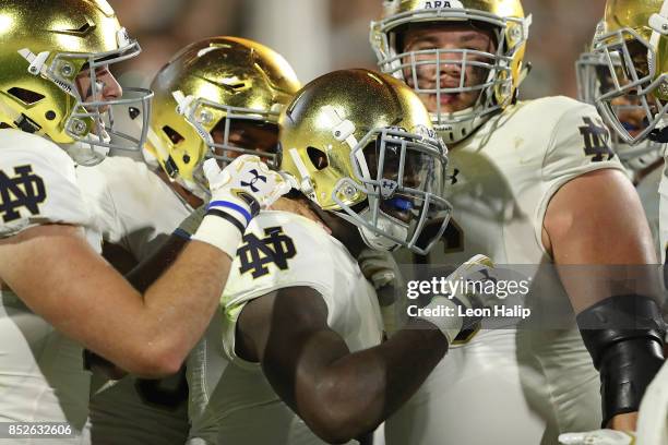 Dexter Williams of the Notre Dame Fighting Irish celebrates a second quarter touchdown during the game against the Michigan State Spartans at Spartan...