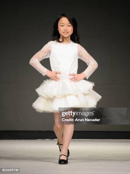 Model walks the runway wearing Cabriolle at 2017 Vancouver Fashion Week - Day 6 on September 23, 2017 in Vancouver, Canada.