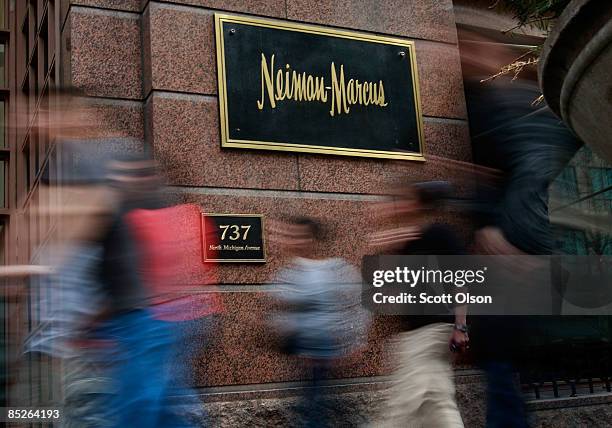 Pedestrians walk past a Neiman Marcus store on the Magnificent Mile March 5, 2009 in Chicago, Illinois. Neiman Marcus Group Inc., which operates...