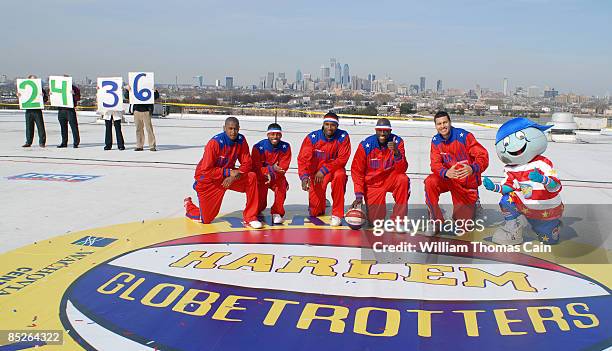 From left, Harlem Globetrotters' Scooter Christensen, Ant Atkinson, Bam Bam Bamiro, Special K Daley, and El Gato Melendez pose for a photo after a...