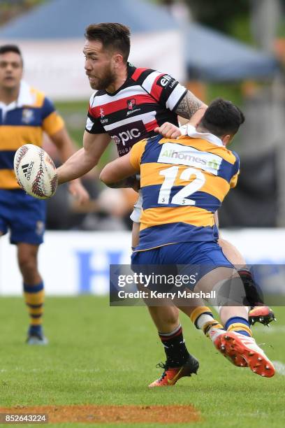 Albert Nikoro of Counties Manukau looks to pass in the tackle of Terrence Hepetema of Bay of Plenty during the round six Mitre 10 Cup match between...