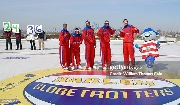 From left, Harlem Globetrotters' Scooter Christensen, Ant Atkinson, Bam Bam Bamiro, Special K Daley, and El Gato Melendez pose for a photo after a...