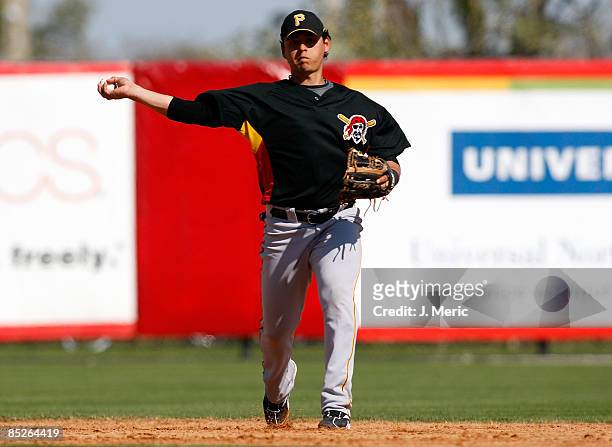 Shortstop Luis Cruz of the Pittsburgh Pirates throws to first for an out against the Cincinnati Reds during a Grapefruit League Spring Training Game...