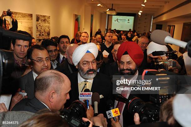 Tony Bedi , a representative for winning bidder Vijay Mallya, who owns Kingfisher beer, speaks to the media after a controversial auction of Mahatma...