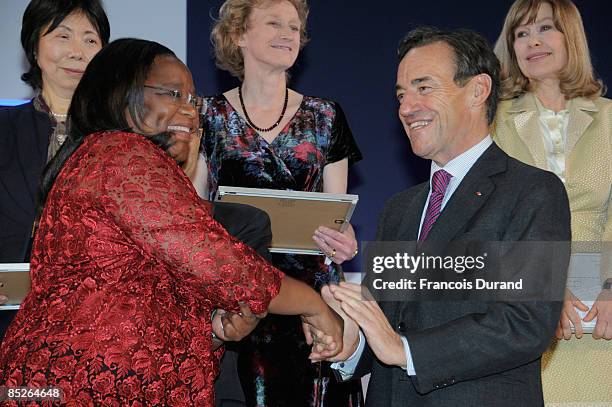 Chairman and CEO of L�OREAL Lindsay Owen-Jones congratulates Professor Tebello Nyokong from Africa as she receives the UNESCO and L'Oreal Award for...