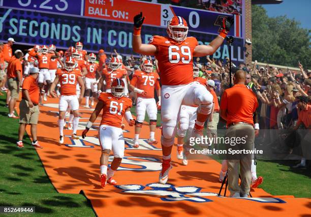 Clemson Tigers offensive lineman Maverick Morris leaps up as he runs down the hill before the game game aginst the Boston College Eagles on September...