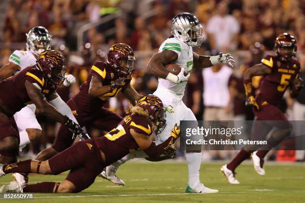 Running back Royce Freeman of the Oregon Ducks rushes the football past defensive back Dasmond Tautalatasi of the Arizona State Sun Devils during the...