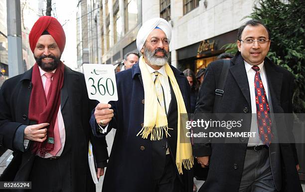 Tony Bedi , Atul Kumari , representatives for winning bidder Vijay Mallya, who owns Kingfisher beer, along with Indian businessman Sant Chatwal walk...