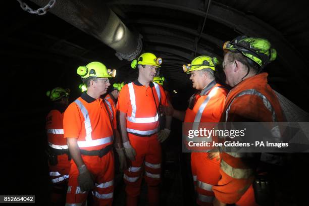 Chancellor George Osborne is given a tour of the mineshaft by chief executive of UK Coal Kevin McCullough , production under-manager Ian Hunter and...