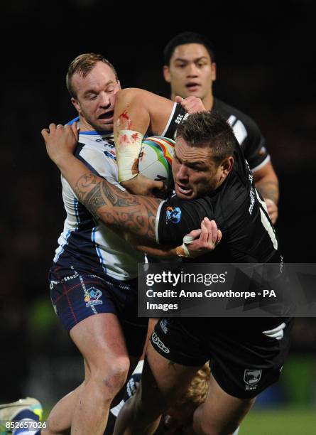 New Zealand's Jared Waerea-Hargreaves is tackled by Scotland's Ian Henderson during the World Cup Quarter Final match at Headingley Stadium, Leeds.