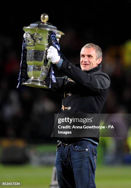 Former England player Jamie Peacock carries out the trophy during the World Cup Quarter Final match at Headingley Stadium, Leeds.