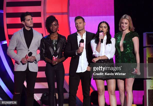 Ryan Seacrest with Casey Cott, Ashleigh Murray, Camila Mendes, and Lili Reinhart speak onstage during the 2017 iHeartRadio Music Festival at T-Mobile...