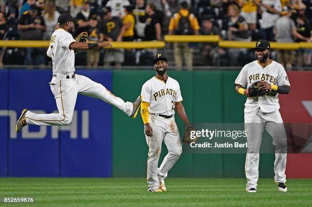 Starling Marte of the Pittsburgh Pirates celebrates with Andrew McCutchen and Gregory Polanco after the final out in the Pittsburgh Pirates 11-6 win...