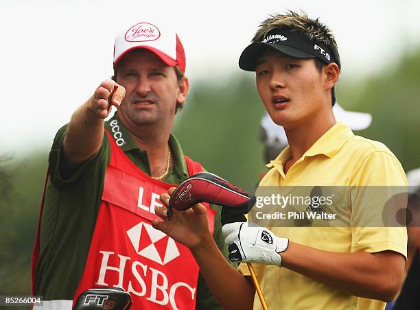 Danny Lee of New Zealand with his caddy Anthony Knight before teeing off on the 1st hole during day two of the New Zealand PGA Championship held at...