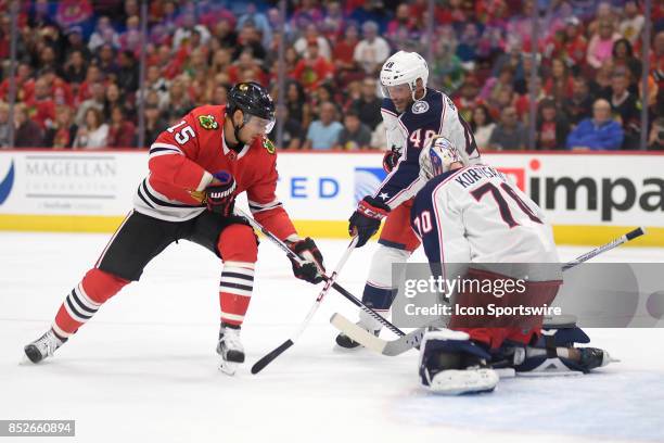 Chicago Blackhawks center Artem Anisimov battle with Columbus Blue Jackets goalie Joonas Korpisalo and Columbus Blue Jackets defenseman Andre Benoit...