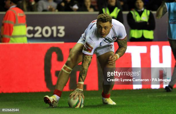 England's Joshua Charnley scores a try during the World Cup Quarter Final at the DW Stadium, Wigan.