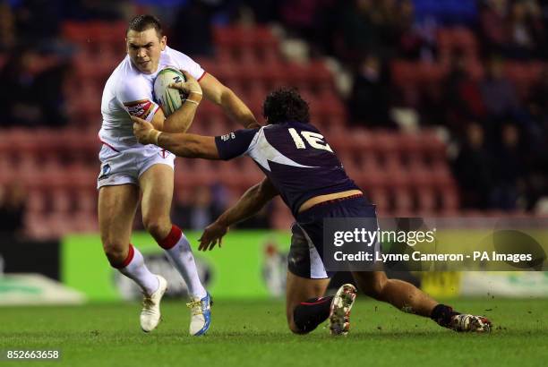 England's Kevin Sinfield and France's Antoni Maria during the World Cup Quarter Final at the DW Stadium, Wigan.