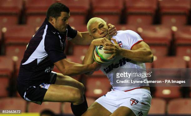 England's Ryan Hall and France's Clint Greenshields in action during the World Cup Quarter Final at the DW Stadium, Wigan.