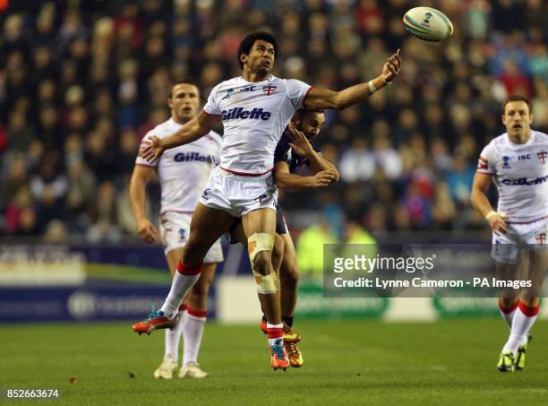 England's Kallum Watkins and France's Eloi Pelissier during the World Cup Quarter Final at the DW Stadium, Wigan.