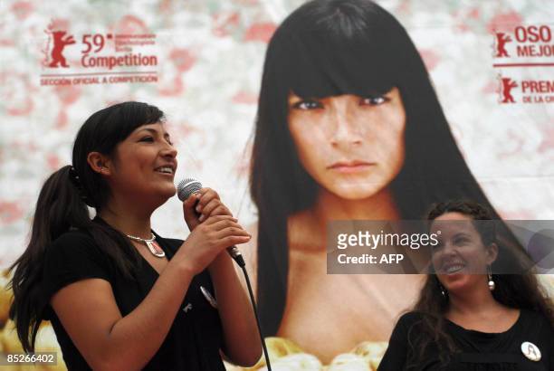 Peruvian director Claudia Llosa , looks at actress Magaly Solier speaking during a press conference to present her film "La Teta Asustada" , in the...