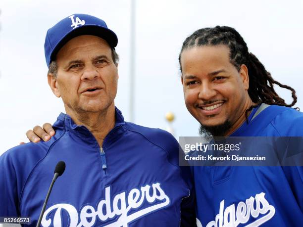 Manny Ramirez of the Los Angeles Dodgers and manager Joe Torre speak during a news conference on March 5 at Camelback Ranch in Glendale, Arizona....