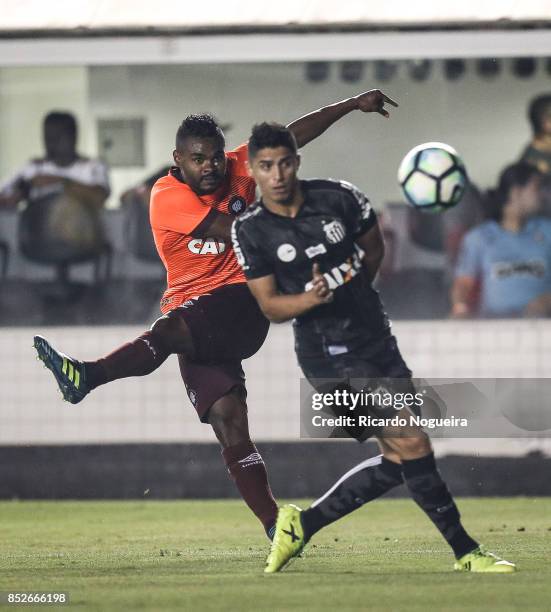 Nikao of Atletico Paranaense battles for the ball with Daniel Guedes of Santos during the match between Santos and Atletico Paranaense as a part of...