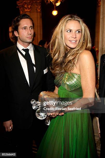 Model Elle Macpherson and guest attend the aftershow party of the 'Women's World Awards' at the city hall on March 05, 2009 in Vienna, Austria.
