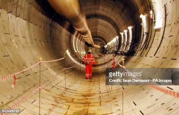 Crossrail worker Sam Agyeman, inspects the first completed section of Crossrail tunnel, after tunnelling machine Phyllis completed the 6.8 kilometre,...