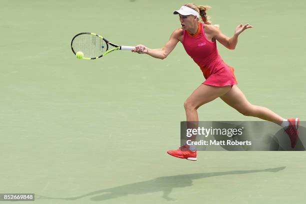 Caroline Wozniacki of Denmark plays a forehand against Anastasia Pavlyuchenkova of Russia during the women's singles final match on day seven of the...