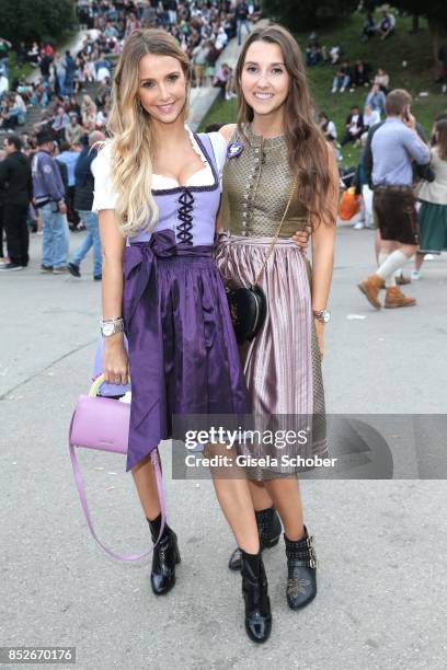 Sophie Hermann and her sister Charlotte Hermann during the Oktoberfest at Theresienwiese on September 23, 2017 in Munich, Germany.