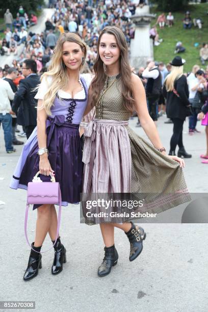 Sophie Hermann and her sister Charlotte Hermann during the Oktoberfest at Theresienwiese on September 23, 2017 in Munich, Germany.