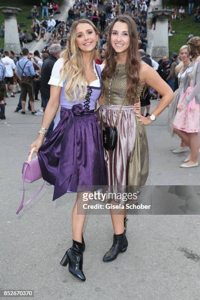 Sophie Hermann and her sister Charlotte Hermann during the Oktoberfest at Theresienwiese on September 23, 2017 in Munich, Germany.