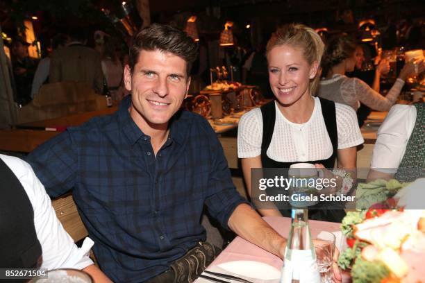 Soccer player Mario Gomez and his wife Carina Wanzung during the Oktoberfest at Theresienwiese on September 23, 2017 in Munich, Germany.