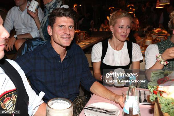 Soccer player Mario Gomez and his wife Carina Wanzung during the Oktoberfest at Theresienwiese on September 23, 2017 in Munich, Germany.