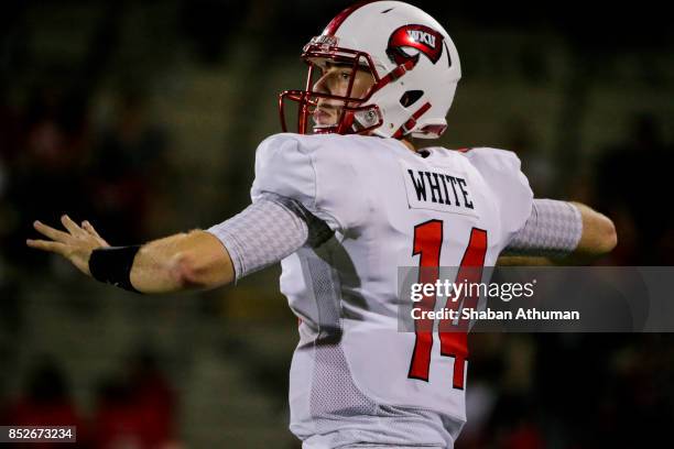 Quarterback Mike White of the Western Kentucky Hilltoppers makes a pass against Ball State on September 23, 2017 in Bowling Green, Kentucky.