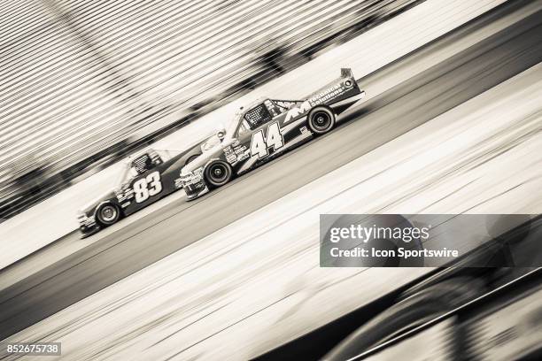 Camping World Truck Series driver Austin Self and Camping World Truck Series driver Patrick Emerling drive down main straight during practice for the...