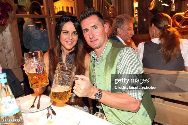 Miroslav Klose and his wife Sylwia Klose during the Oktoberfest at Theresienwiese on September 23, 2017 in Munich, Germany.