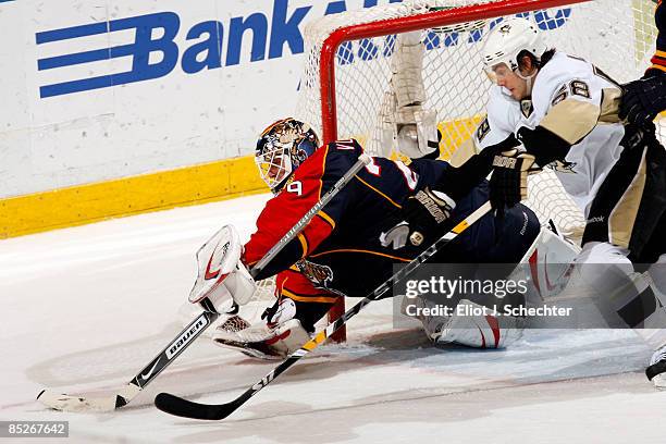 Goaltender Tomas Vokoun of the Florida Panthers defends the net against Kris Letang of the Pittsburgh Penguins at the Bank Atlantic Center on March...