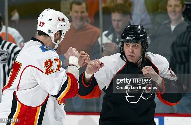 Riley Cote of the Philadelphia Flyers sqaures off with Andre Roy of the Calgary Flames in the first period on March 5, 2009 at the Wachovia Center in...