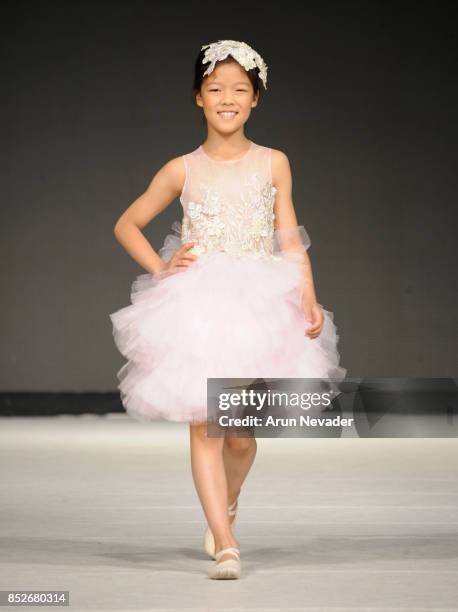 Model walks the runway wearing Cabriolle at 2017 Vancouver Fashion Week - Day 6 on September 23, 2017 in Vancouver, Canada.