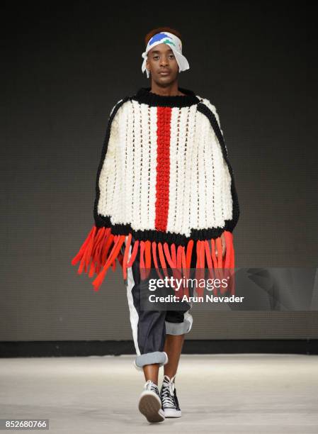 Model walks the runway wearing HUGLAND at 2017 Vancouver Fashion Week - Day 6 on September 23, 2017 in Vancouver, Canada.