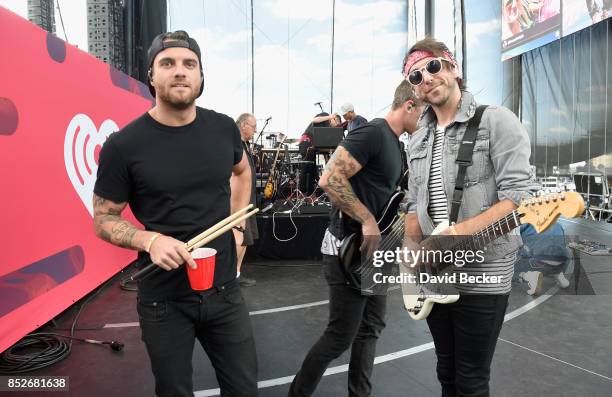 Rian Dawson and Alex Gaskart of All Time Low perform onstage during the Daytime Village Presented by Capital One at the 2017 HeartRadio Music...